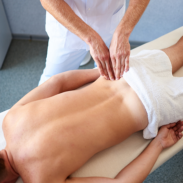 Professional physiotherapy in a cabinet, back massage